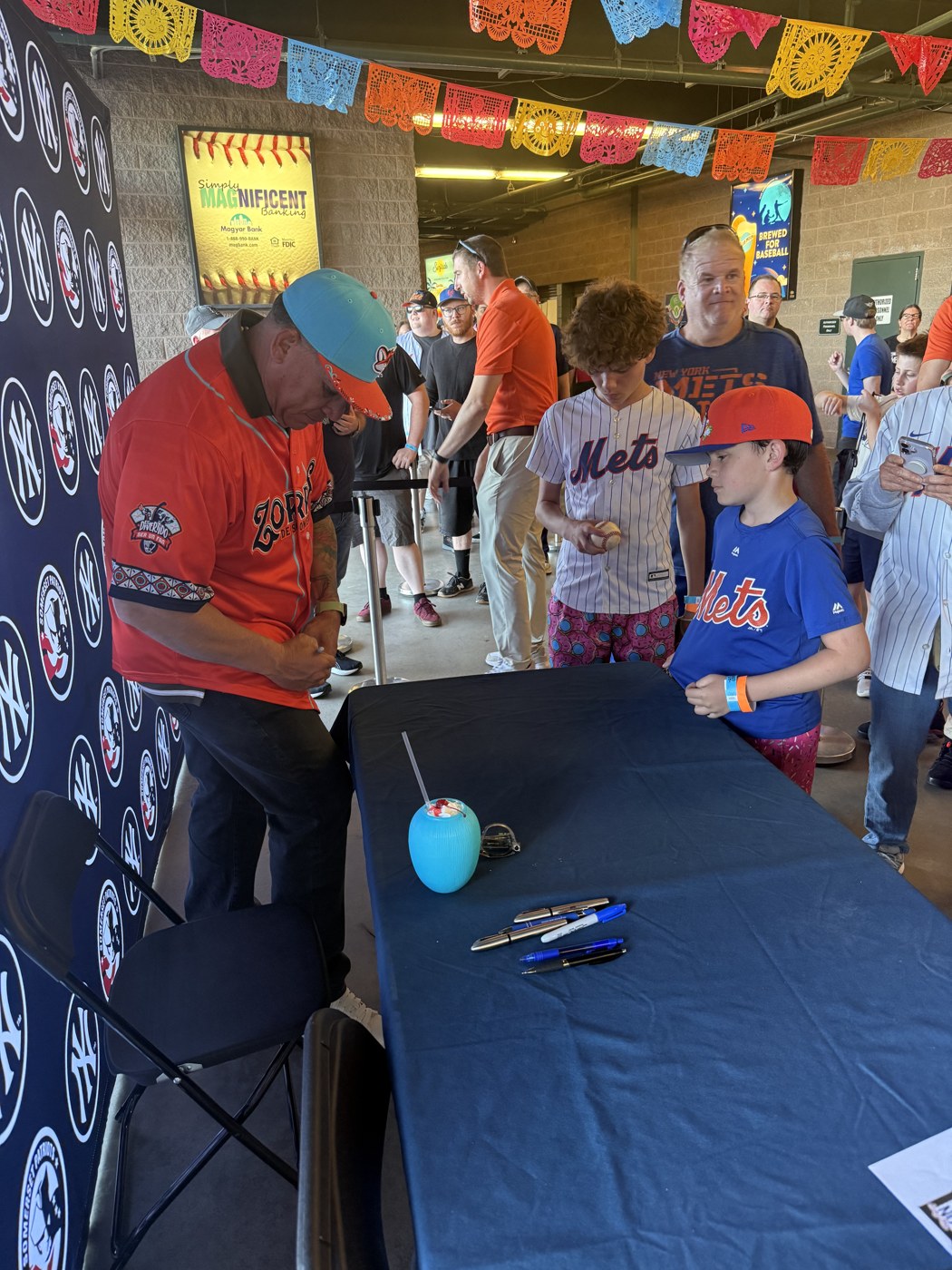 Bartolo Colón signing an autograph for fans at the Somerset Patriots ballpark
